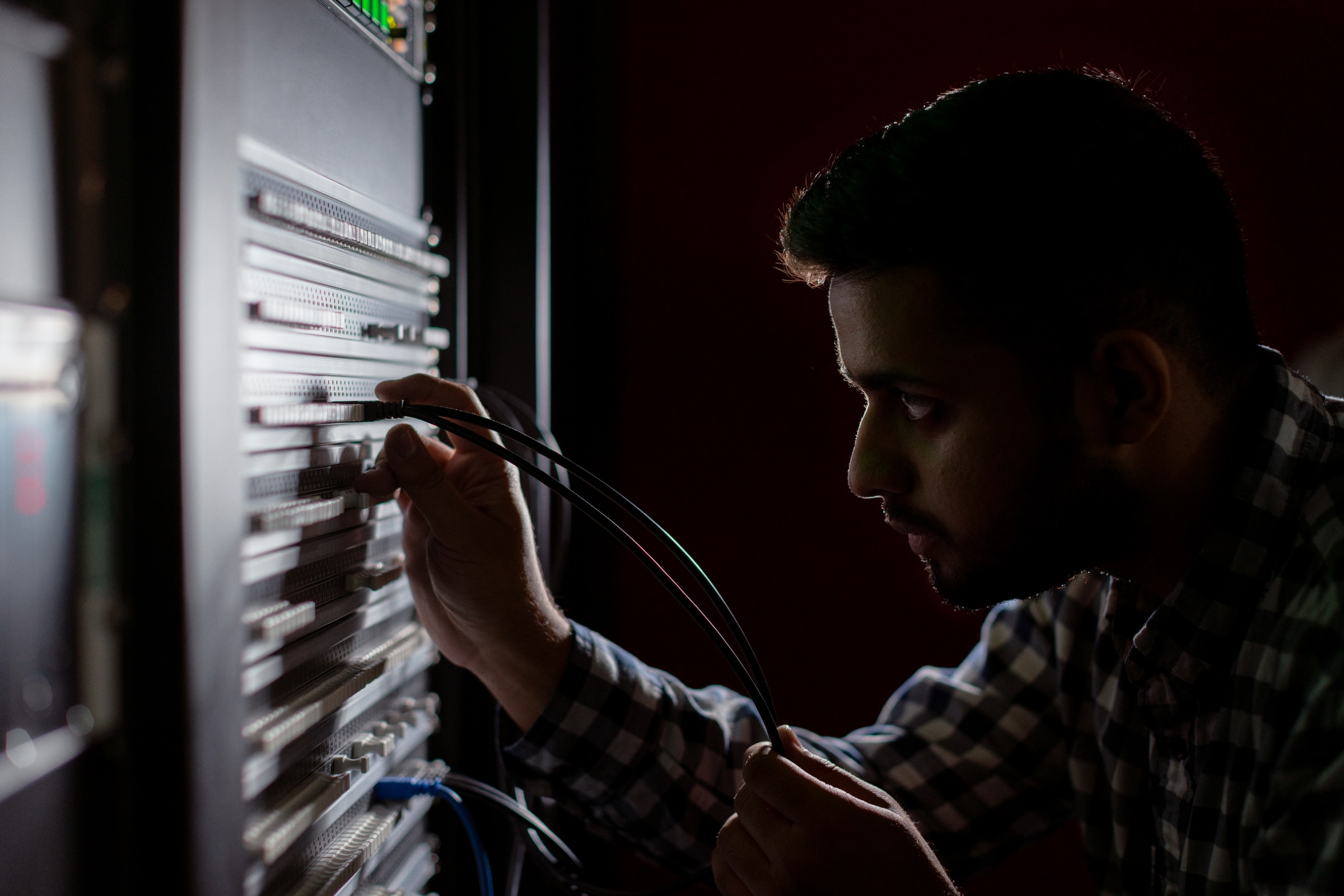 A man setting up IT infrastructure for small business.